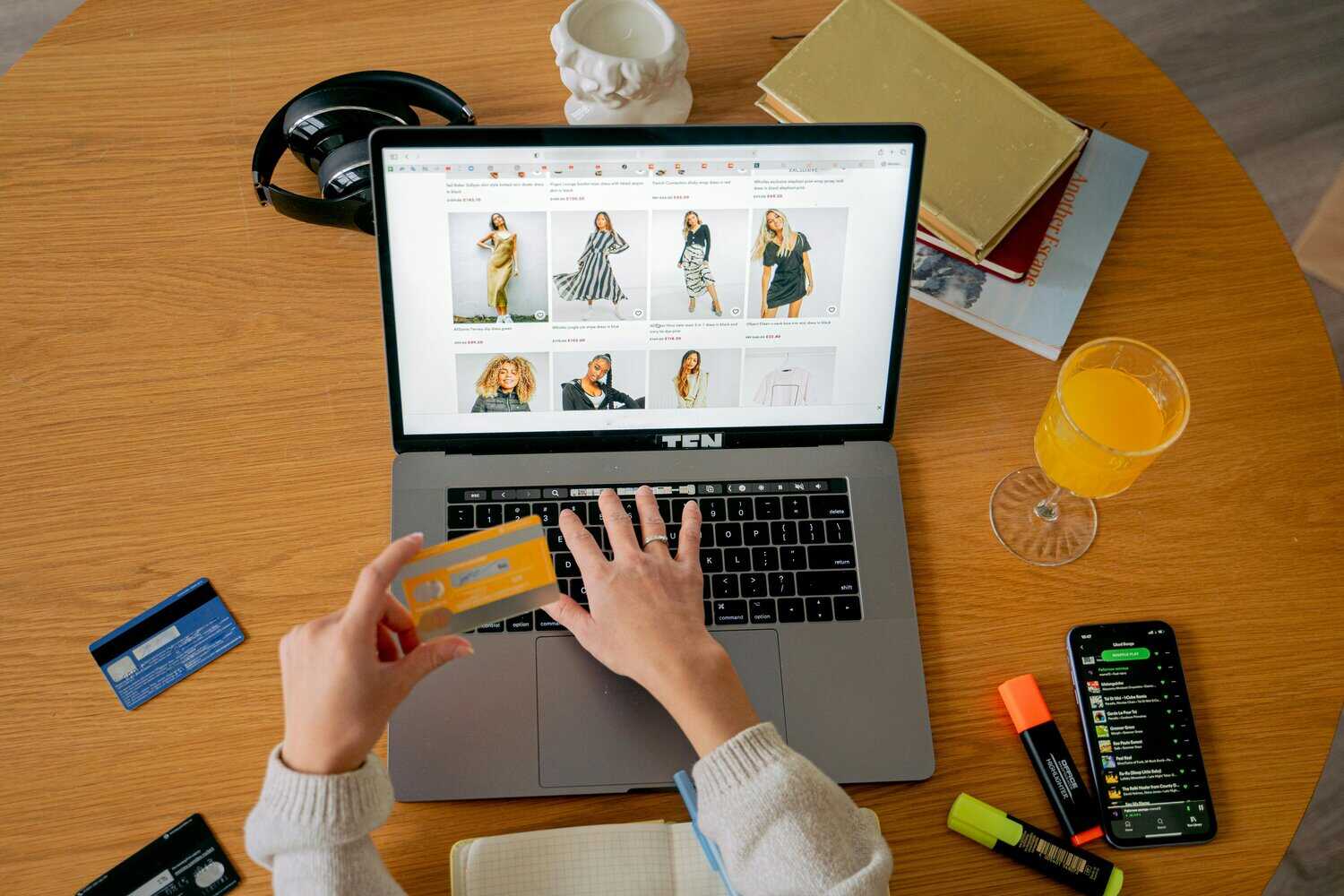 Customer making an international payment with credit card on an online clothing store