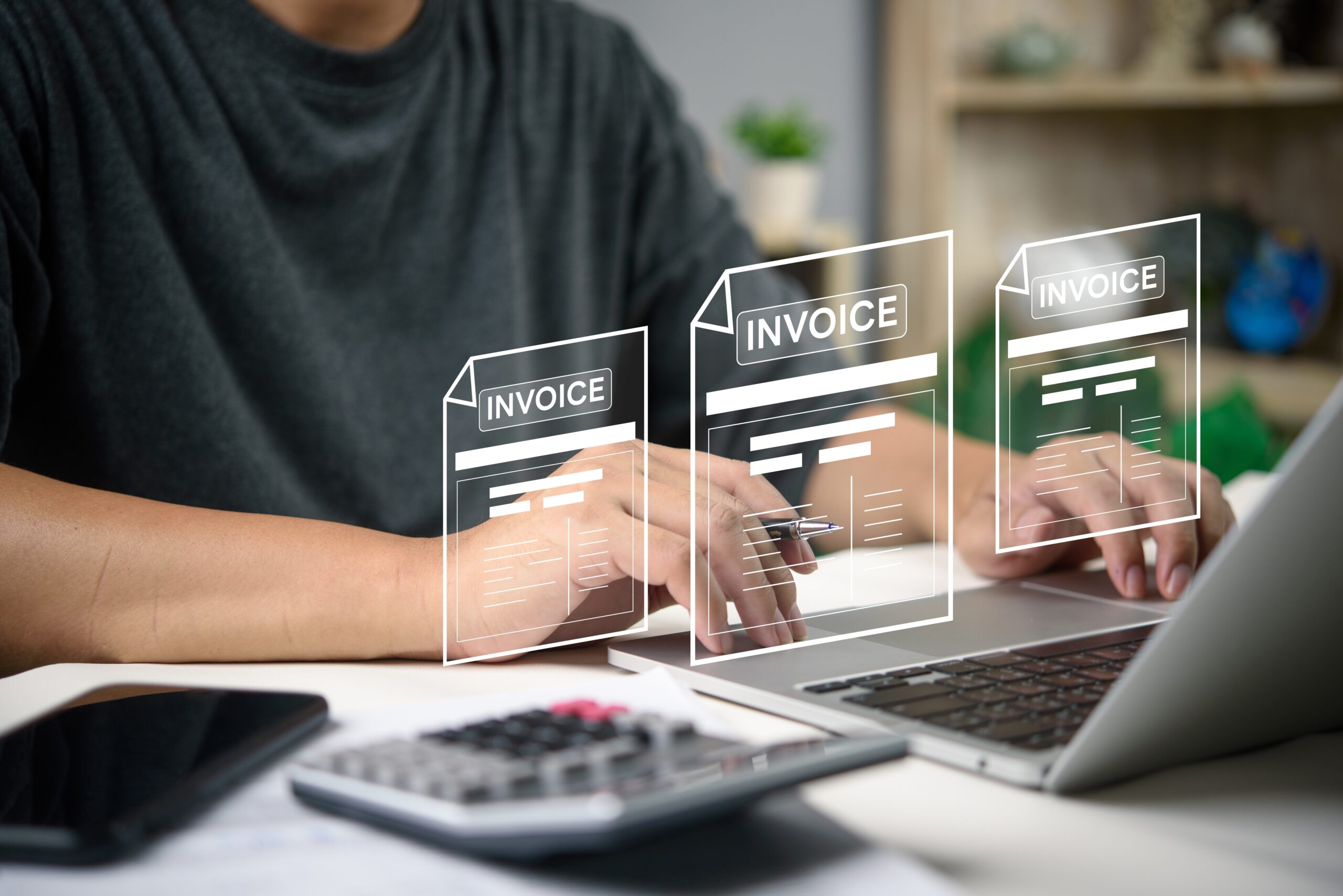 A finance executive handling digital invoicing for payments in Singapore via InvoiceNow. 