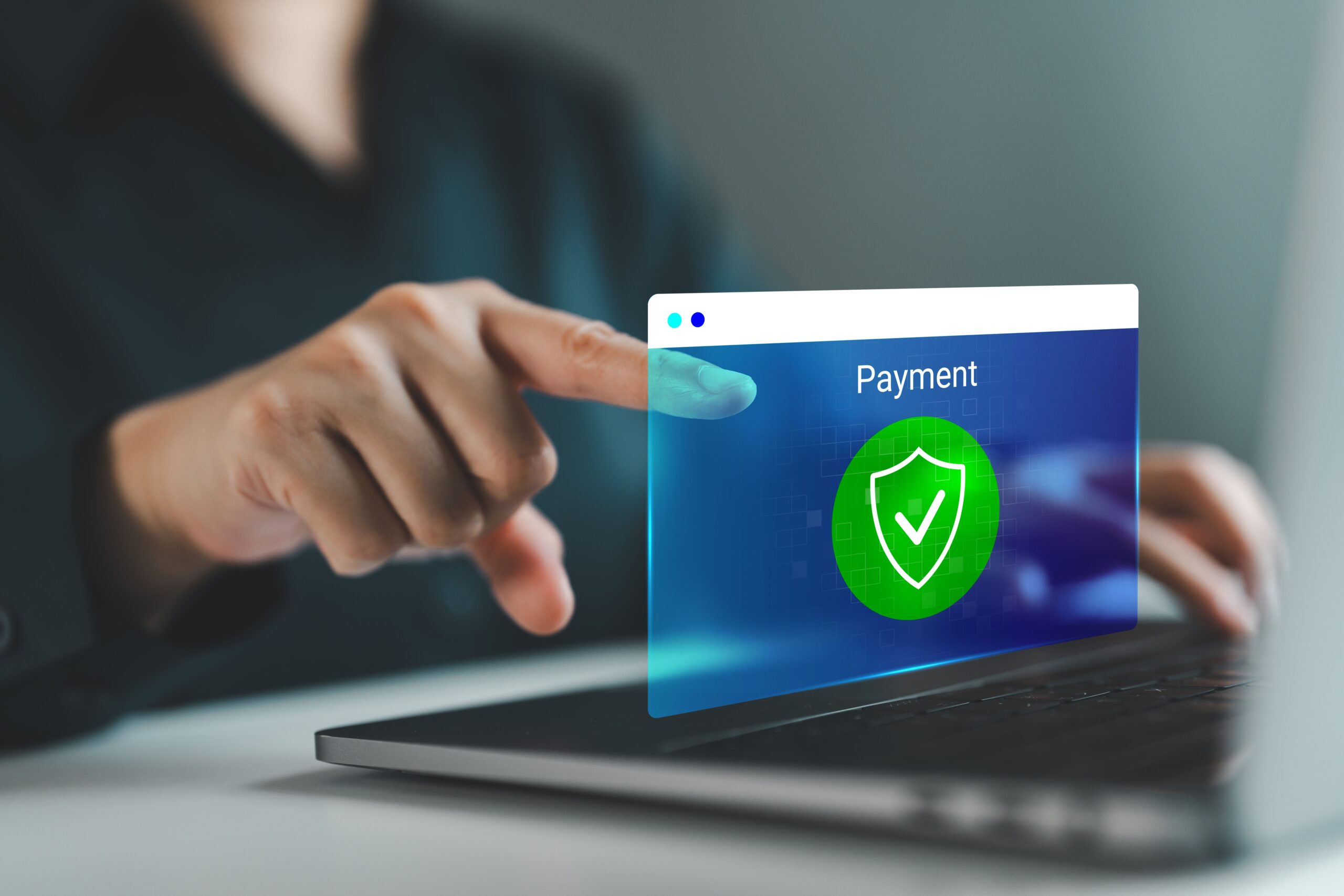 Customer confirming a secure online payment on a laptop